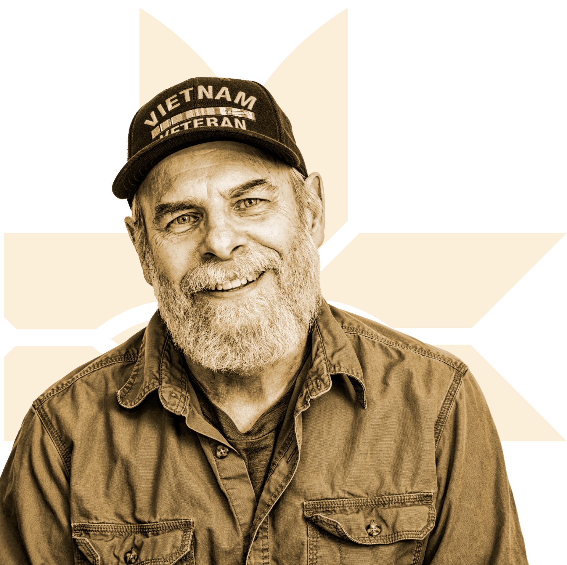 Smiling older man with a beard wearing a Vietnam Veteran cap and a button-up shirt, in front of a stylized yellow star background.