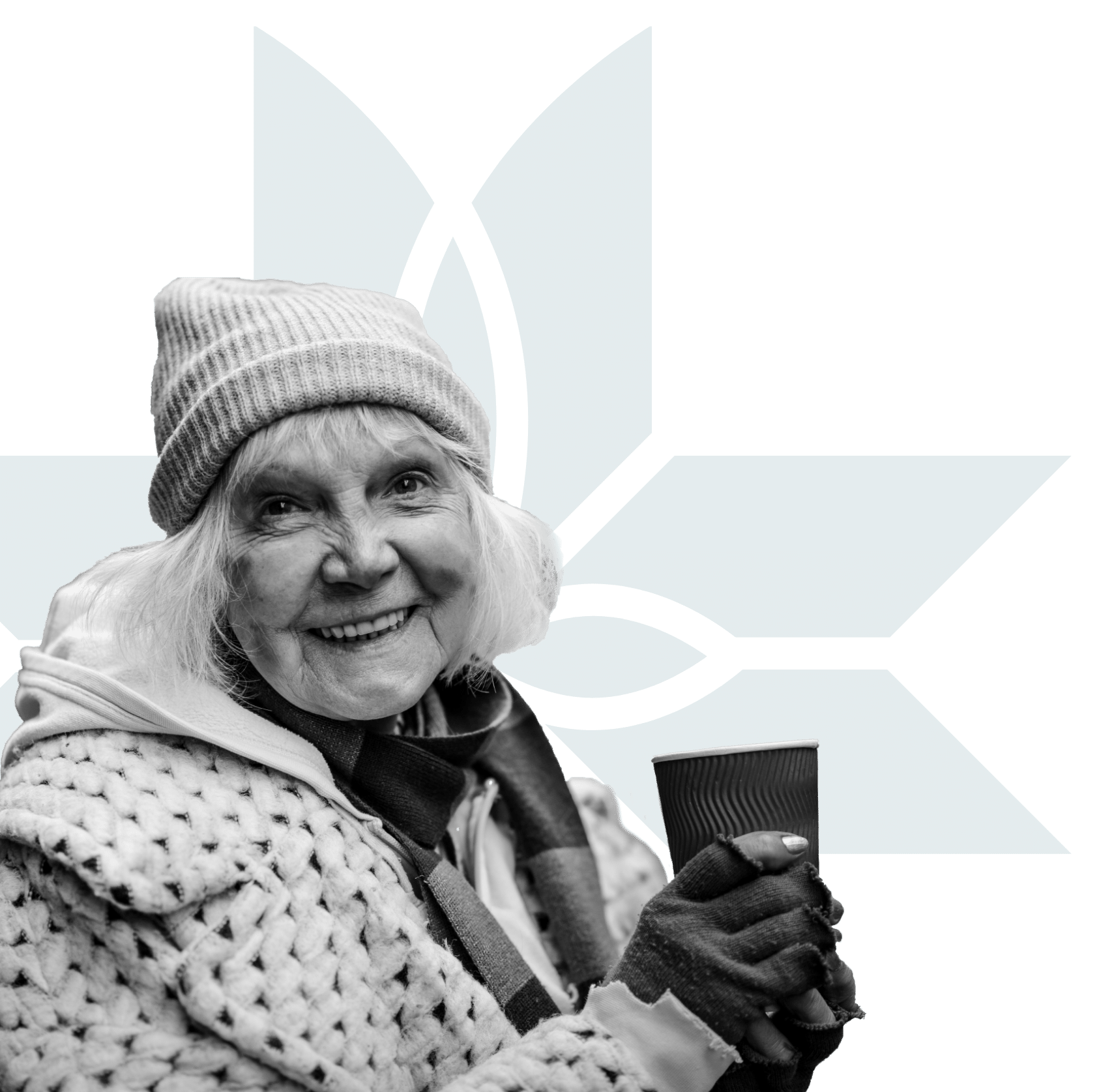 An older woman in winter clothing and a beanie smiles while holding a coffee cup. The background features a geometric teal and black design.